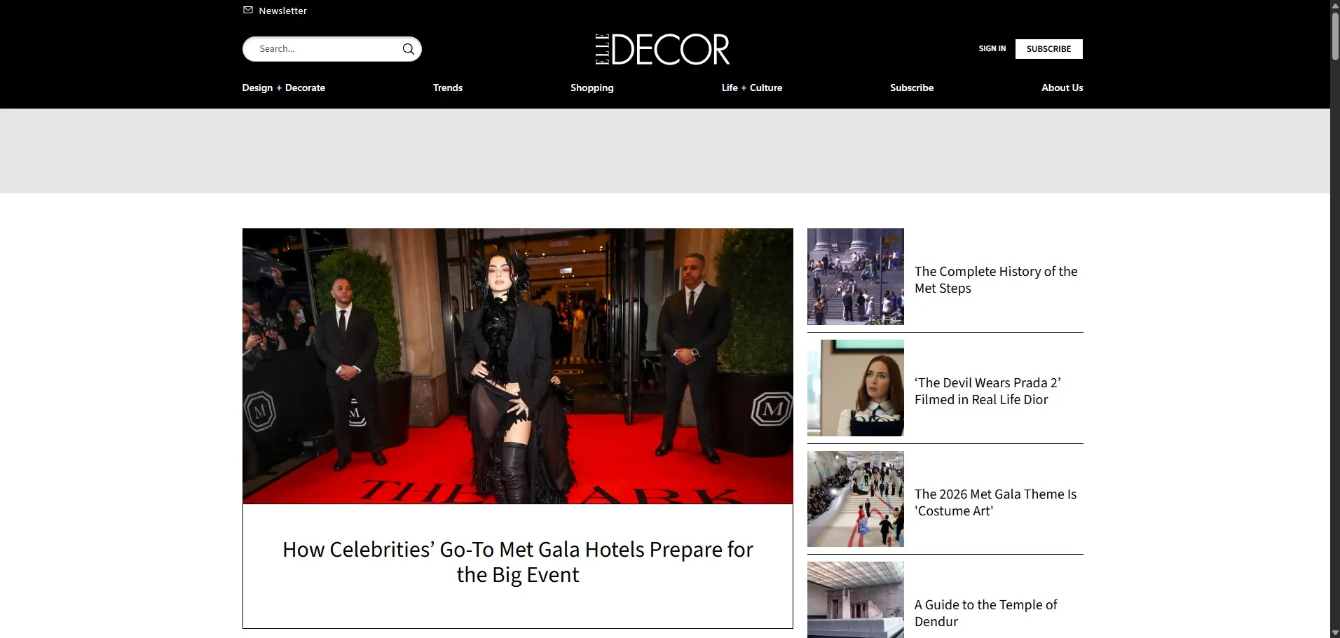 Elle Decor website homepage featuring an article on Met Gala hotels with a celebrity on the red carpet and design culture news.